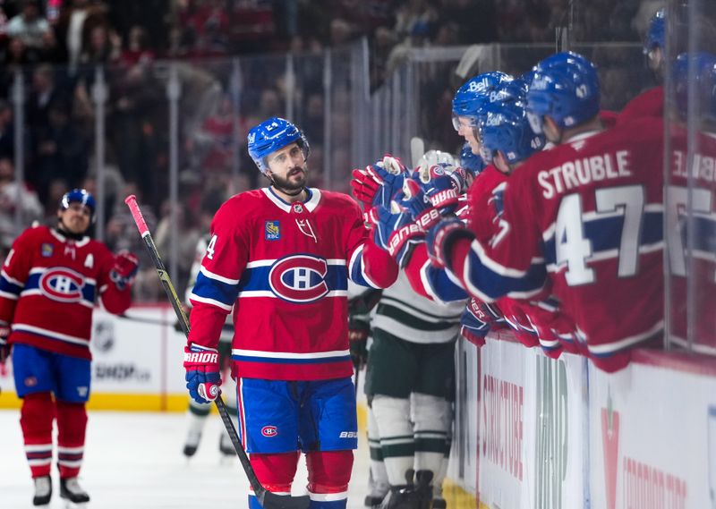 Jan 20, 2026; Montreal, Quebec, CAN; Montreal Canadiens defenseman Logan Mailloux (24) celebrates with teammates after scoring a goal against the Minnesota Wild during the first period at the Bell Centre. Mandatory Credit: Eric Bolte-Imagn Images