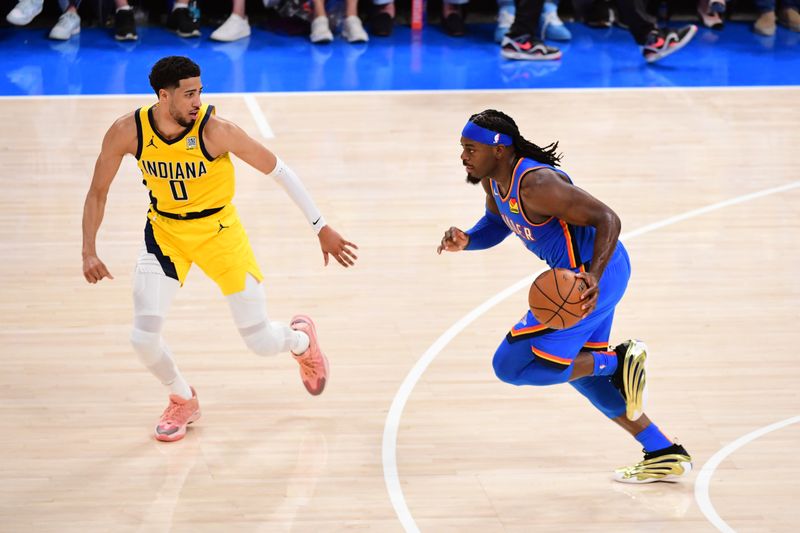 OKLAHOMA CITY, OK - JUNE 8: Luguentz Dort #5 of the Oklahoma City Thunder handles the ball during the game against the Indiana Pacers during Game Two of the 2025 NBA Finals on June 8, 2025 at Paycom Center in Oklahoma City, Oklahoma. NOTE TO USER: User expressly acknowledges and agrees that, by downloading and or using this photograph, User is consenting to the terms and conditions of the Getty Images License Agreement. Mandatory Copyright Notice: Copyright 2025 NBAE (Photo by Adam Pantozzi/NBAE via Getty Images)