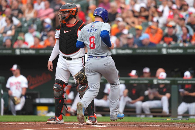 Jul 9, 2024; Baltimore, Maryland, USA; Chicago Cubs outfielder Ian Happ (8) scores in the second inning against the Baltimore Orioles at Oriole Park at Camden Yards. Mandatory Credit: Mitch Stringer-USA TODAY Sports