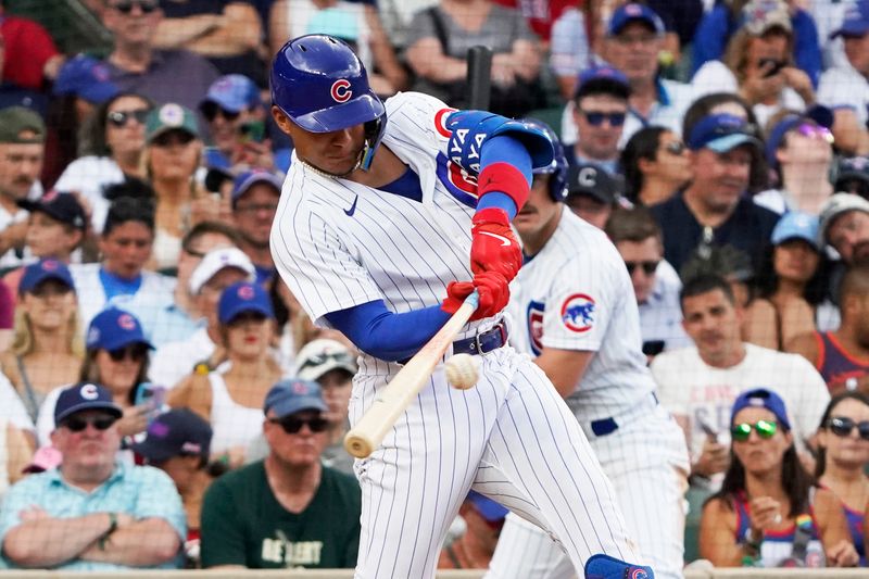 Jul 15, 2023; Chicago, Illinois, USA; Chicago Cubs designated hitter Miguel Amaya (6) hits a one run single against the Boston Red Sox during the seventh inning at Wrigley Field. Mandatory Credit: David Banks-USA TODAY Sports