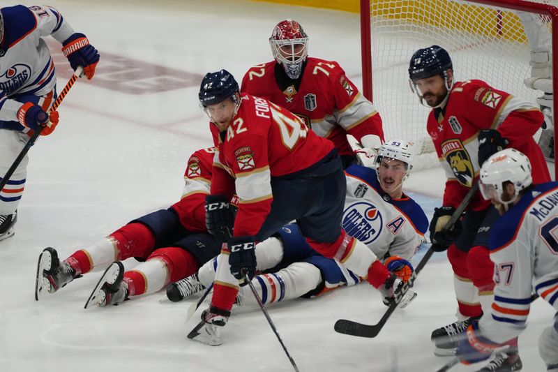 Jun 24, 2024; Sunrise, Florida, USA; Florida Panthers defenseman Gustav Forsling (42) defends against Edmonton Oilers forward Connor McDavid (97) during the third period in game seven of the 2024 Stanley Cup Final at Amerant Bank Arena. Mandatory Credit: Jim Rassol-USA TODAY Sports