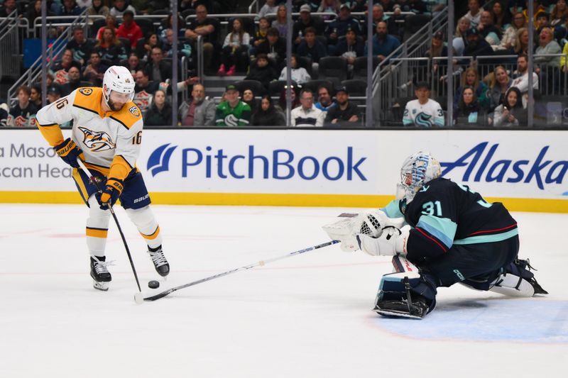 Mar 16, 2024; Seattle, Washington, USA; Seattle Kraken goaltender Philipp Grubauer (31) reaches for the puck played by Nashville Predators left wing Jason Zucker (16) during the third period at Climate Pledge Arena. Mandatory Credit: Steven Bisig-USA TODAY Sports