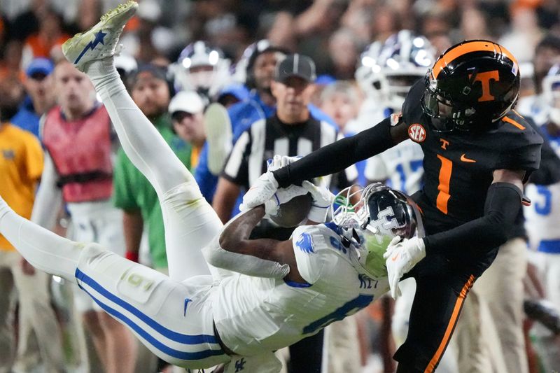 Nov 2, 2024; Knoxville, Tennessee, USA; Kentucky Wildcats wide receiver Dane Key (6) makes a catch against Tennessee Volunteers defensive back Rickey Gibson III (1) during the first half at Neyland Stadium. Mandatory Credit: Saul Young/USA TODAY Network via Imagn Images
