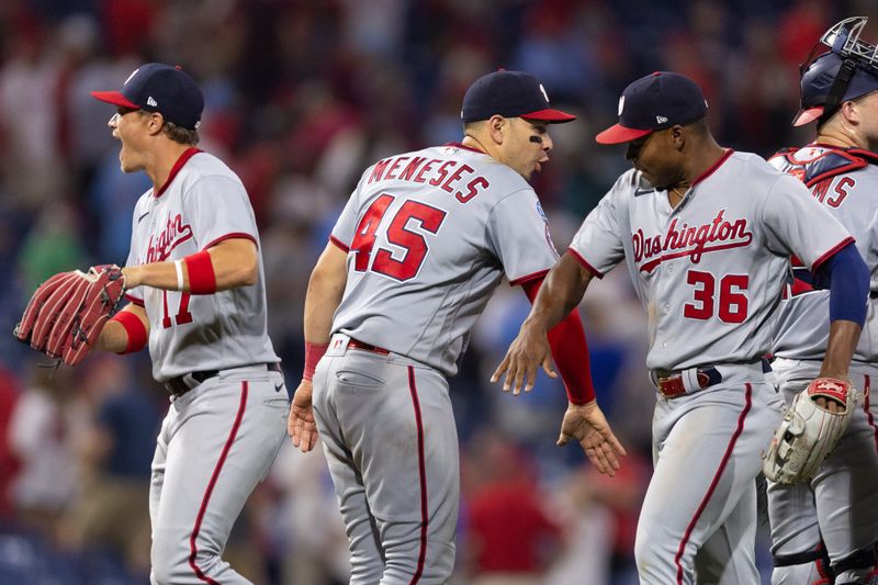 Aug 8, 2023; Philadelphia, Pennsylvania, USA; Washington Nationals designated hitter Joey Meneses (45) celebrates with left fielder Stone Garrett (36) and center fielder Alex Call (17) after a victory against the Philadelphia Phillies at Citizens Bank Park. Mandatory Credit: Bill Streicher-USA TODAY Sports