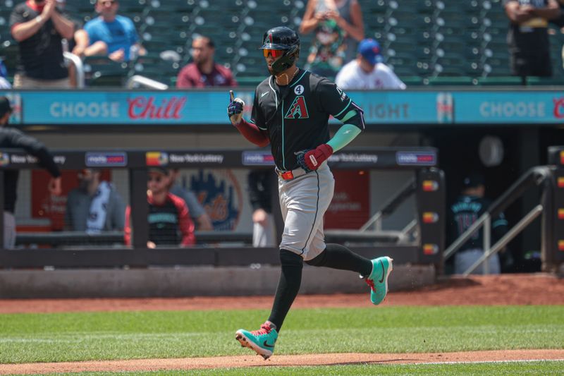 Jun 2, 2024; New York City, New York, USA;  Arizona Diamondbacks left fielder Lourdes Gurriel Jr. (12) runs the bases after hitting a solo home run during the first inning against the New York Mets at Citi Field. Mandatory Credit: Vincent Carchietta-USA TODAY Sports