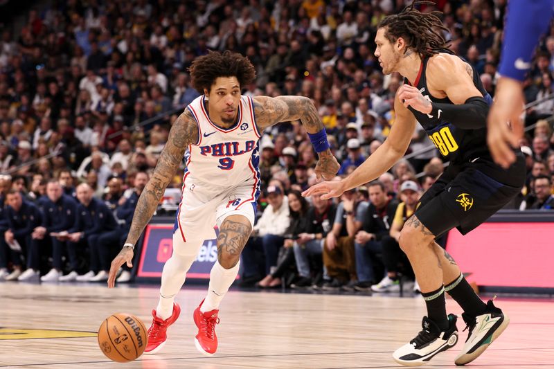 DENVER, COLORADO - JANUARY 27: Kelly Oubre Jr. #9 of the Philadelphia 76ers dribbles around Aaron Gordon #50 of the Denver Nuggets during the first half of the game between the Denver Nuggets and the Philadelphia 76ers at Ball Arena on January 27, 2024 in Denver, Colorado. NOTE TO USER: User expressly acknowledges and agrees that, by downloading and or using this photograph, User is consenting to the terms and conditions of the Getty Images License Agreement. (Photo by Justin Tafoya/Getty Images)