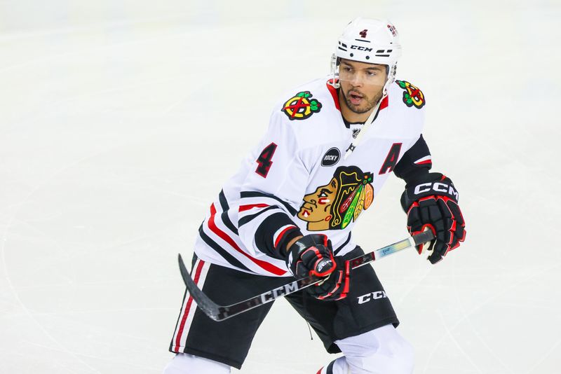 Jan 27, 2024; Calgary, Alberta, CAN; Chicago Blackhawks defenseman Seth Jones (4) skates during the warmup period against the Calgary Flames at Scotiabank Saddledome. Mandatory Credit: Sergei Belski-USA TODAY Sports