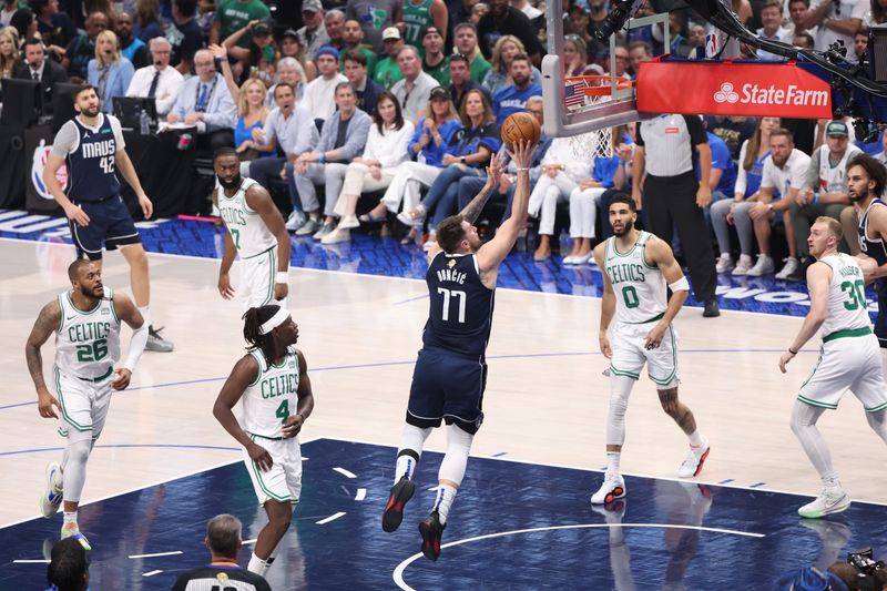 DALLAS, TX - JUNE 14: Luka Doncic #77 of the Dallas Mavericks shoots the ball during the game against the Boston Celtics during Game 4 of the 2024 NBA Finals on June 14, 2024 at the American Airlines Center in Dallas, Texas. NOTE TO USER: User expressly acknowledges and agrees that, by downloading and or using this photograph, User is consenting to the terms and conditions of the Getty Images License Agreement. Mandatory Copyright Notice: Copyright 2024 NBAE (Photo by Joe Murphy/NBAE via Getty Images)