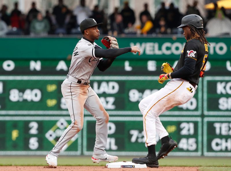 Apr 7, 2023; Pittsburgh, Pennsylvania, USA;  Chicago White Sox shortstop Tim Anderson (7) throws to first base after forcing Pittsburgh Pirates shortstop Oneil Cruz (15) out at second base during the seventh inning at PNC Park. The Pirates won 13-9. Mandatory Credit: Charles LeClaire-USA TODAY Sports