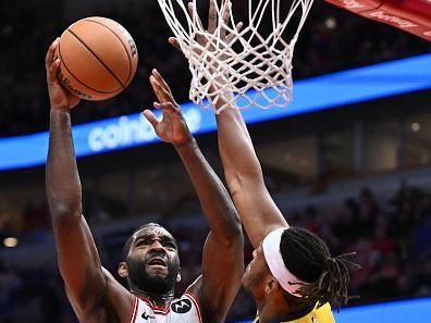 CHICAGO, ILLINOIS - DECEMBER 28:  Patrick Williams #44 of the Chicago Bulls drives to the basket while being defended by Myles Turner #33 of the Indiana Pacers in the second half on December 28, 2023 at the United Center in Chicago, Illinois. Indiana defeated Chicago 120-104.   NOTE TO USER: User expressly acknowledges and agrees that, by downloading and or using this photograph, User is consenting to the terms and conditions of the Getty Images License Agreement.  (Photo by Jamie Sabau/Getty Images)