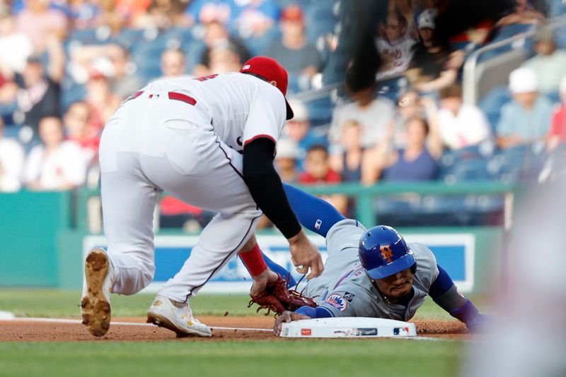 Jun 3, 2024; Washington, District of Columbia, USA; Washington Nationals first base Joey Gallo (24) attempts to r=tag New York Mets shortstop Francisco Lindor (12) on a pickoff attempt during the first inning at Nationals Park. Mandatory Credit: Geoff Burke-USA TODAY Sports