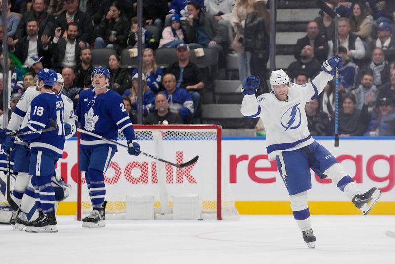 Nov 6, 2023; Toronto, Ontario, CAN; Tampa Bay Lightning forward Brayden Point (21) celebrates his goal against the Toronto Maple Leafs during the first period at Scotiabank Arena. Mandatory Credit: John E. Sokolowski-USA TODAY Sports