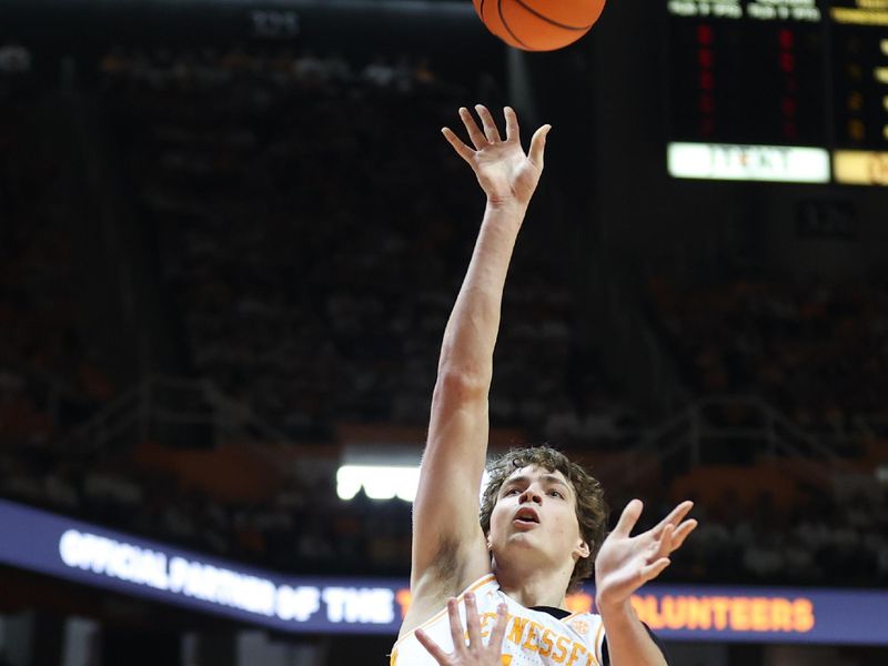 Feb 1, 2025; Knoxville, Tennessee, USA; Tennessee Volunteers forward Cade Phillips (12) shoots the ball against the Florida Gators during the first half at Thompson-Boling Arena at Food City Center. Mandatory Credit: Randy Sartin-Imagn Images