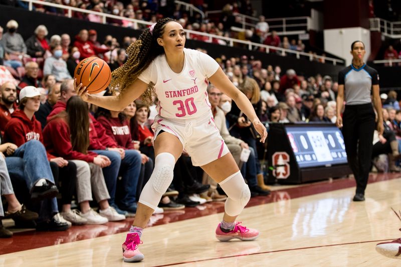 Feb 17, 2023; Stanford, California, USA;  Stanford Cardinal guard Haley Jones (30) passes against the USC Trojans during the first half at Maples Pavilion. Mandatory Credit: John Hefti-USA TODAY Sports