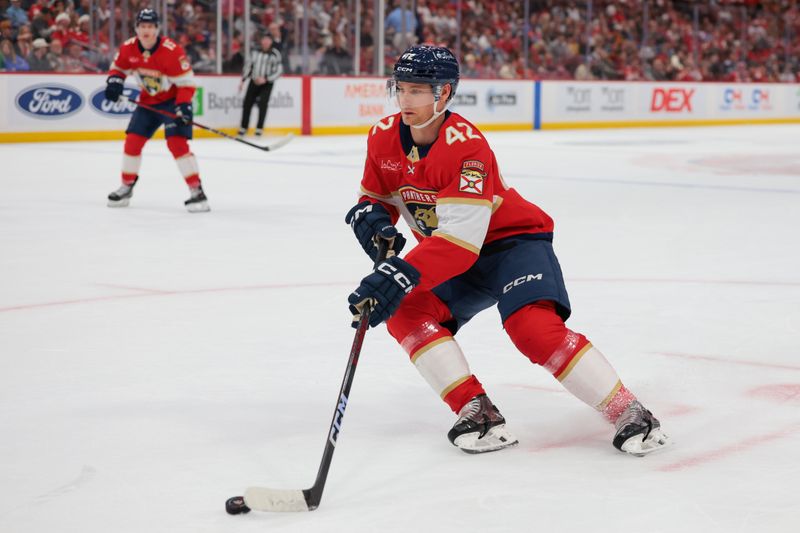 Dec 20, 2025; Sunrise, Florida, USA; Florida Panthers defenseman Gustav Forsling (42) moves the puck against the St. Louis Blues during the first period at Amerant Bank Arena. Mandatory Credit: Sam Navarro-Imagn Images