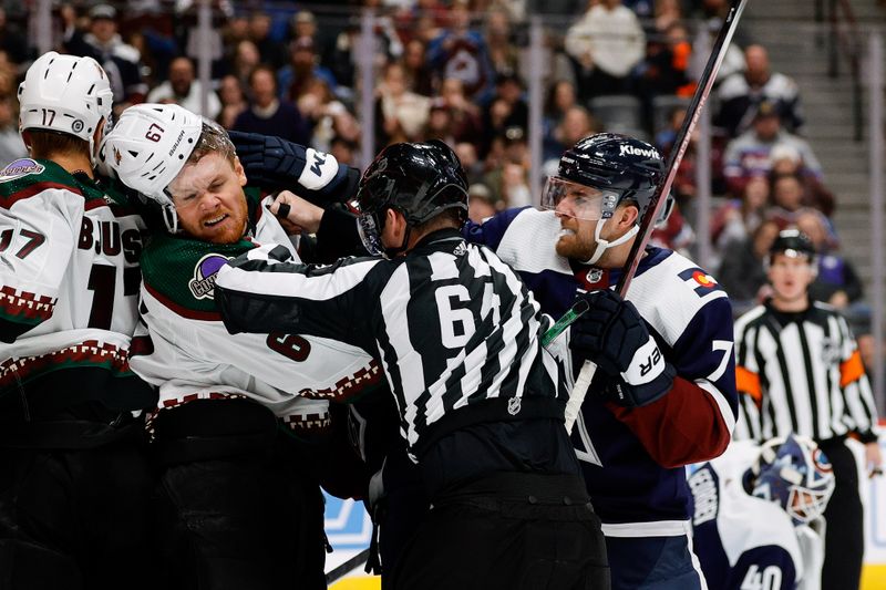 Feb 18, 2024; Denver, Colorado, USA; Colorado Avalanche defenseman Devon Toews (7) and Arizona Coyotes left wing Lawson Crouse (67) scuffle as linesman Brandon Gawryletz (64) separates them in the third period at Ball Arena. Mandatory Credit: Isaiah J. Downing-USA TODAY Sports