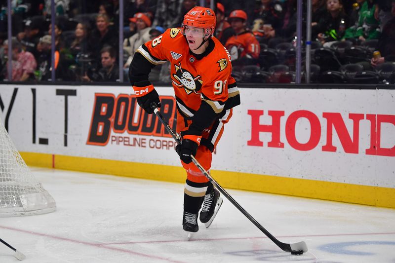 Jan 13, 2026; Anaheim, California, USA; Anaheim Ducks defenseman Pavel Mintyukov (98) controls the puck against the Dallas Stars during the second period at Honda Center. Mandatory Credit: Gary A. Vasquez-Imagn Images