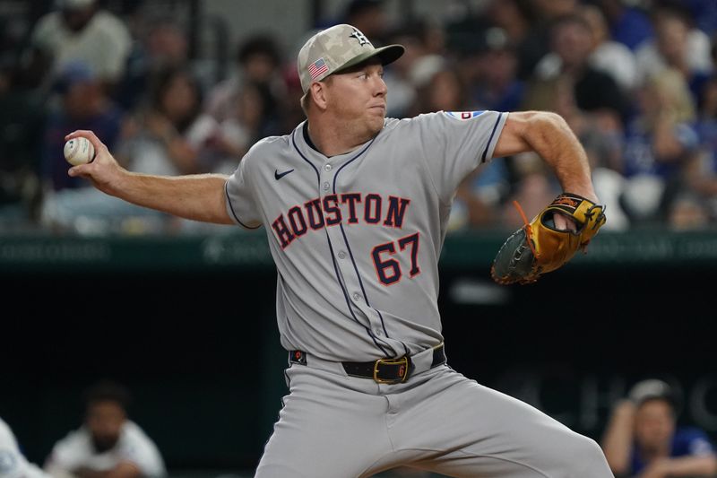 May 17, 2025; Arlington, Texas, USA; Houston Astros pitcher Ryan Gusto (67) throws to the plate during the eighth inning against the Texas Rangers at Globe Life Field. Mandatory Credit: Raymond Carlin III-Imagn Images
