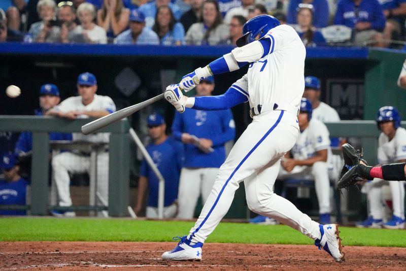 Aug 20, 2024; Kansas City, Missouri, USA; Kansas City Royals shortstop Bobby Witt Jr. (7) hits a one-run double against the Los Angeles Angels in the seventh inning at Kauffman Stadium. Mandatory Credit: Denny Medley-USA TODAY Sports