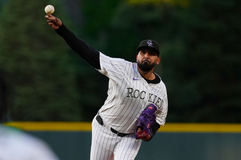 Jun 7, 2025; Denver, Colorado, USA; Colorado Rockies starting pitcher German Marquez (48) delivers a pitch in the first inning against the New York Mets at Coors Field. Mandatory Credit: Ron Chenoy-Imagn Images