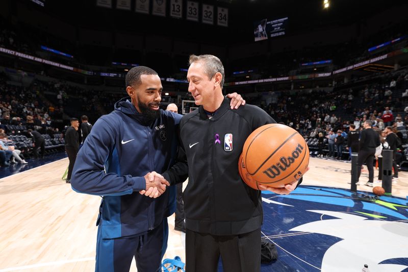 MINNEAPOLIS, MN -  FEBRUARY 2: Mike Conley #10 of the Minnesota Timberwolves shakes hands with referee J.T. Orr #72 before the game on February 2, 2024 at Target Center in Minneapolis, Minnesota. NOTE TO USER: User expressly acknowledges and agrees that, by downloading and or using this Photograph, user is consenting to the terms and conditions of the Getty Images License Agreement. Mandatory Copyright Notice: Copyright 2024 NBAE (Photo by David Sherman/NBAE via Getty Images)