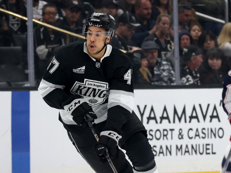 Nov 9, 2024; Los Angeles, California, USA; Los Angeles Kings left wing Andre Lee (47) skates with the puck during the second period against the Columbus Blue Jackets at Crypto.com Arena. Mandatory Credit: Jason Parkhurst-Imagn Images