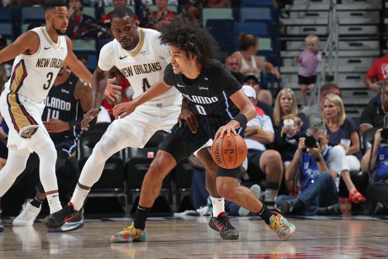 NEW ORLEANS, LA - OCTOBER 7: Anthony Black #0 of the Orlando Magic dribbles the ball during the game against the New Orleans Pelicans on October 7, 2024 at the Smoothie King Center in New Orleans, Louisiana. NOTE TO USER: User expressly acknowledges and agrees that, by downloading and or using this Photograph, user is consenting to the terms and conditions of the Getty Images License Agreement. Mandatory Copyright Notice: Copyright 2024 NBAE (Photo by Layne Murdoch Jr./NBAE via Getty Images)