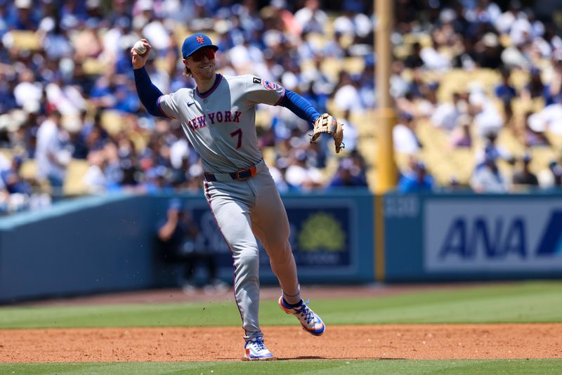 Jun 5, 2025; Los Angeles, California, USA; New York Mets third base Brett Baty (7) throws to first during the second inning against the Los Angeles Dodgers  at Dodger Stadium. Mandatory Credit: Jason Parkhurst-Imagn Images