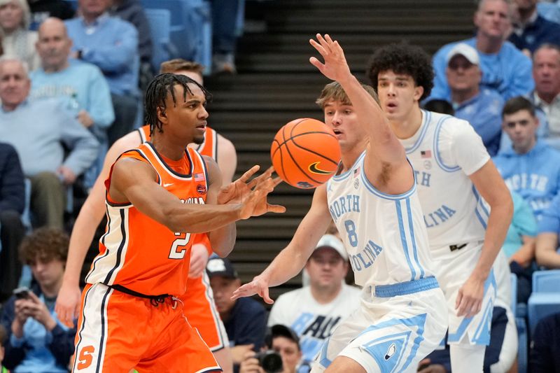 Jan 13, 2024; Chapel Hill, North Carolina, USA;  Syracuse Orange guard JJ Starling (2) passes the ball as North Carolina Tar Heels guard Paxson Wojcik (8) defends in the second half at Dean E. Smith Center. Mandatory Credit: Bob Donnan-USA TODAY Sports