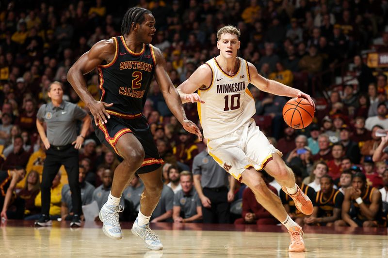 Jan 9, 2026; Minneapolis, Minnesota, USA; Minnesota Golden Gophers forward Cade Tyson (10) works around Southern California Trojans forward Ezra Ausar (2) during the first half at Williams Arena. Mandatory Credit: Matt Krohn-Imagn Images