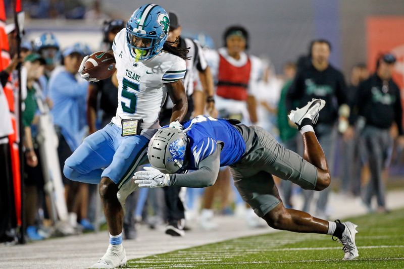 Oct 13, 2023; Memphis, Tennessee, USA; Tulane Green Wave wide receiver Yulkeith Brown (5) runs after a catch as Memphis Tigers defensive back Simeon Blair (5) knocks him out of bounds during the first half at Simmons Bank Liberty Stadium. Mandatory Credit: Petre Thomas-USA TODAY Sports