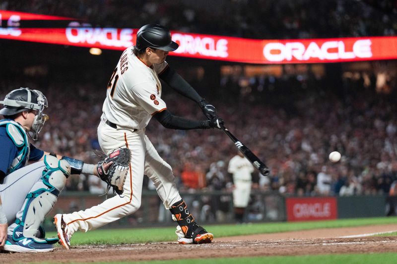 Jul 3, 2023; San Francisco, California, USA;  San Francisco Giants first baseman Wilmer Flores (41) hits a single during the ninth inning against the Seattle Mariners at Oracle Park. Mandatory Credit: Stan Szeto-USA TODAY Sports