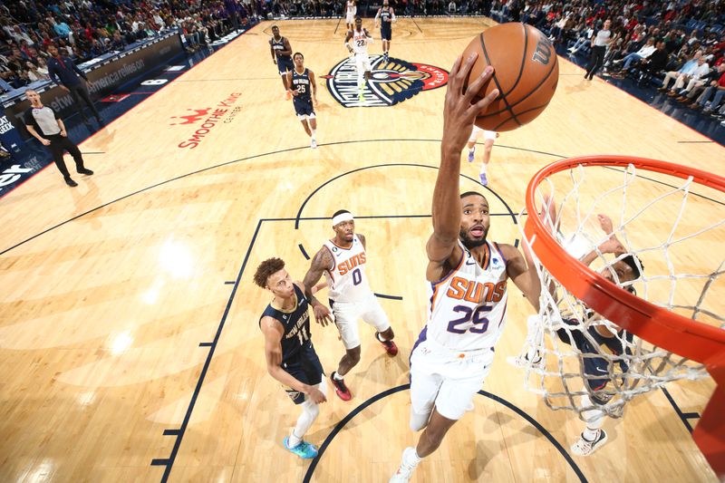 NEW ORLEANS, LA - DECEMBER 11: Mikal Bridges #25 of the Phoenix Suns drives to the basket during the game against the New Orleans Pelicans on December 11, 2022 at the Smoothie King Center in New Orleans, Louisiana. NOTE TO USER: User expressly acknowledges and agrees that, by downloading and or using this Photograph, user is consenting to the terms and conditions of the Getty Images License Agreement. Mandatory Copyright Notice: Copyright 2022 NBAE (Photo by Ned Dishman/NBAE via Getty Images)