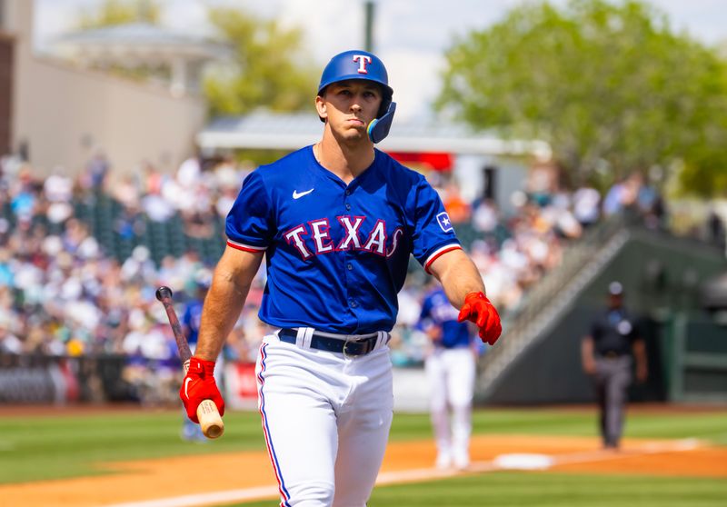 Mar 18, 2024; Surprise, Arizona, USA; Texas Rangers outfielder Wyatt Langford against the Seattle Mariners during a spring training baseball game at Surprise Stadium. Mandatory Credit: Mark J. Rebilas-USA TODAY Sports