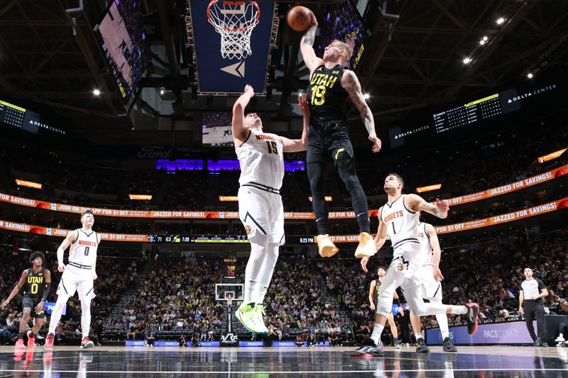 SALT LAKE CITY, UT - APRIL 9: Luka Samanic #19 of the Utah Jazz dunks the ball during the game against the Denver Nuggets on April 9, 2024 at Delta Center in Salt Lake City, Utah. NOTE TO USER: User expressly acknowledges and agrees that, by downloading and or using this Photograph, User is consenting to the terms and conditions of the Getty Images License Agreement. Mandatory Copyright Notice: Copyright 2024 NBAE (Photo by Melissa Majchrzak/NBAE via Getty Images)