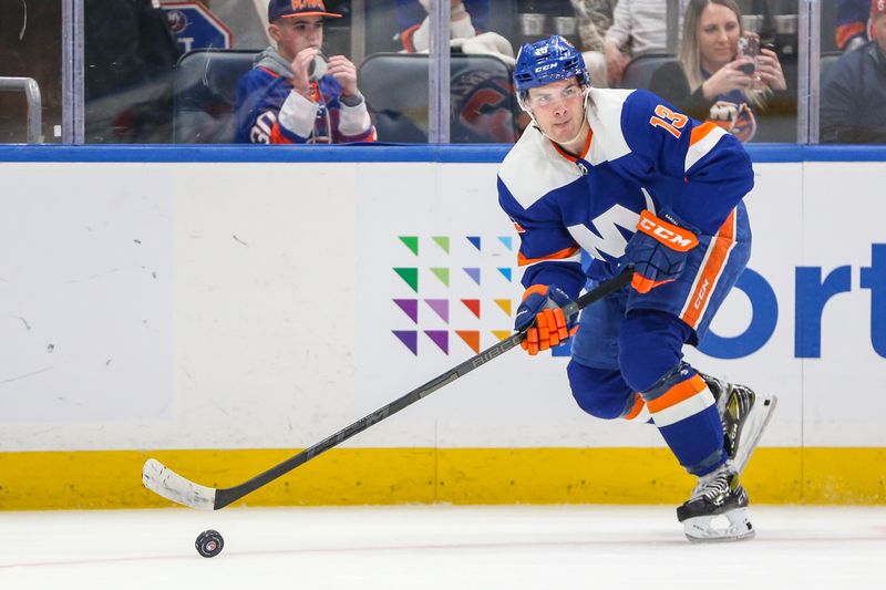 Feb 24, 2024; Elmont, New York, USA;  New York Islanders center Mathew Barzal (13) controls the puck in the third period against the Tampa Bay Lightning at UBS Arena. Mandatory Credit: Wendell Cruz-USA TODAY Sports