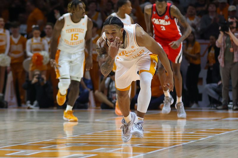 Jan 6, 2024; Knoxville, Tennessee, USA; Tennessee Volunteers guard Zakai Zeigler (5) reacts after shooting a three pointer against the Mississippi Rebels during the second half at Thompson-Boling Arena at Food City Center. Mandatory Credit: Randy Sartin-USA TODAY Sports