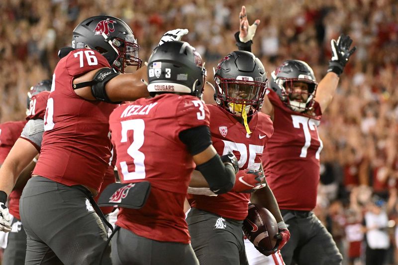 Sep 9, 2023; Pullman, Washington, USA; Washington State Cougars running back Nakia Watson (25) celebrates with his teammates after a touchdown against the Wisconsin Badgers in the second half at Gesa Field at Martin Stadium. Washington State won 31-22. Mandatory Credit: James Snook-USA TODAY Sports