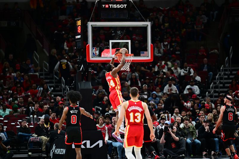 CHICAGO, IL - APRIL 1: Bruno Fernando #24 of the Atlanta Hawks dunks the ball during the game against the Chicago Bulls on April 1, 2024 at United Center in Chicago, Illinois. NOTE TO USER: User expressly acknowledges and agrees that, by downloading and or using this photograph, User is consenting to the terms and conditions of the Getty Images License Agreement. Mandatory Copyright Notice: Copyright 2024 NBAE (Photo by Adam Hagy/NBAE via Getty Images)