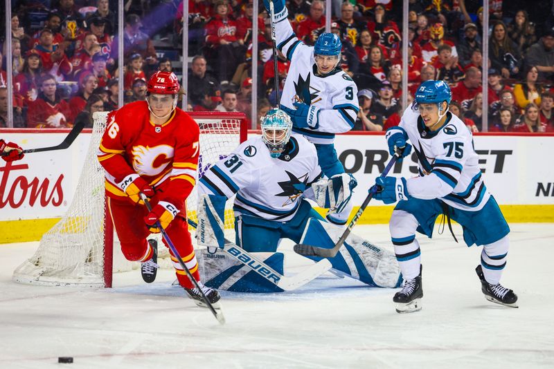 Apr 18, 2024; Calgary, Alberta, CAN; San Jose Sharks goaltender Georgi Romanov (31) guards his net against the Calgary Flames during the second period at Scotiabank Saddledome. Mandatory Credit: Sergei Belski-USA TODAY Sports