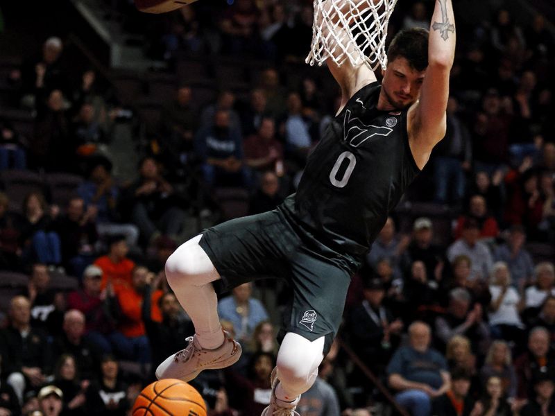 Jan 23, 2024; Blacksburg, Virginia, USA; Virginia Tech Hokies guard Hunter Cattoor (0) dunks the ball during the second half against the Boston College Eagles at Cassell Coliseum. Mandatory Credit: Peter Casey-USA TODAY Sports