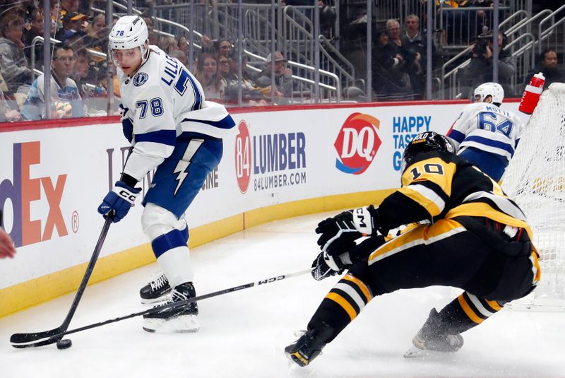 Apr 6, 2024; Pittsburgh, Pennsylvania, USA;  Tampa Bay Lightning defenseman Emil Lilleberg (78) handles the puck against Pittsburgh Penguins left wing Drew O'Connor (10) during the first period at PPG Paints Arena. Mandatory Credit: Charles LeClaire-USA TODAY Sports