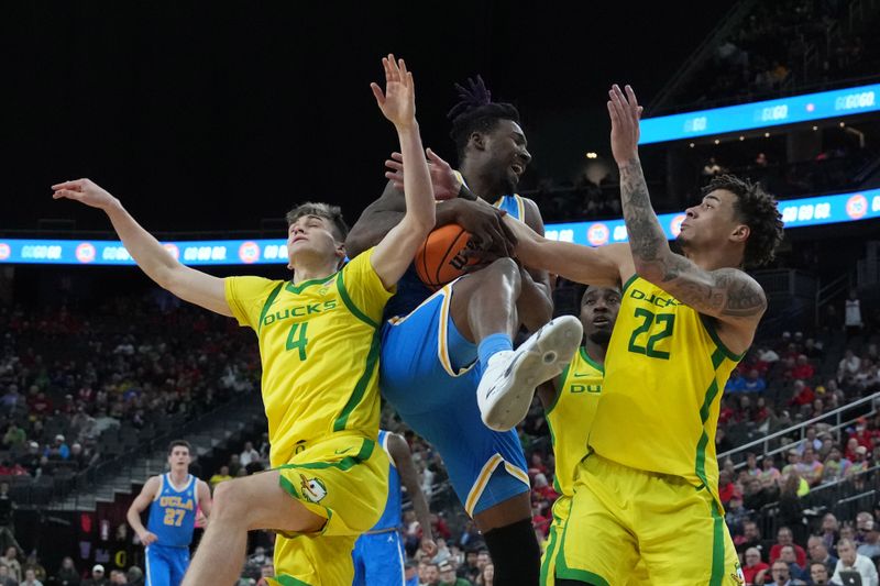 Mar 14, 2024; Las Vegas, NV, USA; UCLA Bruins forward Kenneth Nwuba (14) battles for the ball with Oregon Ducks4 and guard Jadrian Tracey (22) in the first half at T-Mobile Arena. Mandatory Credit: Kirby Lee-USA TODAY Sports