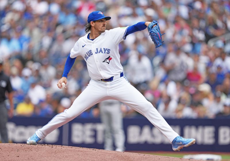 Jun 30, 2024; Toronto, Ontario, CAN; Toronto Blue Jays starting pitcher Kevin Gausman (34) throws a pitch game against the New York Yankees during the first inning at Rogers Centre. Mandatory Credit: Nick Turchiaro-USA TODAY Sports