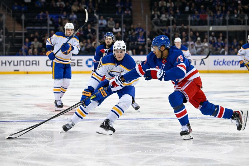 Nov 7, 2024; New York, New York, USA;  New York Rangers defenseman K'Andre Miller (79) defends against Buffalo Sabres center Tage Thompson (72) during the third period at Madison Square Garden. Mandatory Credit: Dennis Schneidler-Imagn Images