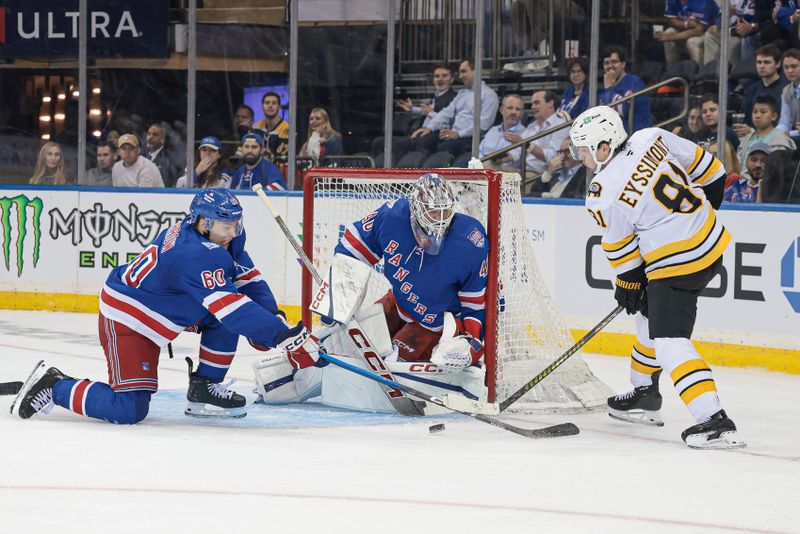 Sep 23, 2025; New York, New York, USA; Boston Bruins center Michael Eyssimont (81) passes the puck as New York Rangers defenseman Scott Morrow (60) defends in front of goaltender Talyn Boyko (40) during the third period of a preseason game at Madison Square Garden. Mandatory Credit: Vincent Carchietta-Imagn Images
