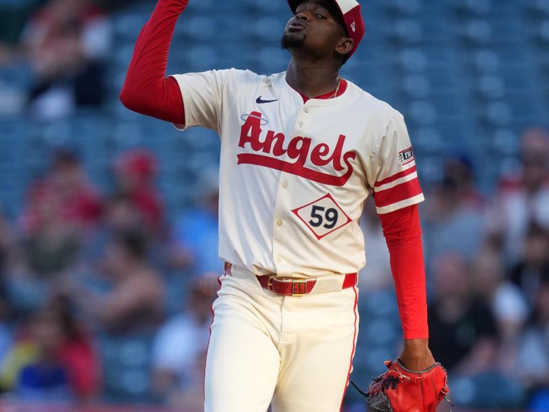 May 8, 2025; Anaheim, California, USA; Los Angeles Angels starting pitcher Jose Soriano (59) gestures at the end of the first inning against the Toronto Blue Jays at Angel Stadium. Mandatory Credit: Kirby Lee-Imagn Images