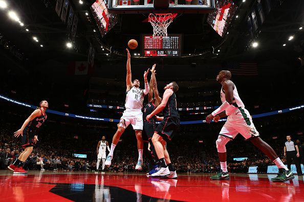 TORONTO, CANADA - NOVEMBER 15:  Brook Lopez #11 of the Milwaukee Bucks drives to the basket during the game against the Toronto Raptors on November 15, 2023 at the Scotiabank Arena in Toronto, Ontario, Canada.  NOTE TO USER: User expressly acknowledges and agrees that, by downloading and or using this Photograph, user is consenting to the terms and conditions of the Getty Images License Agreement.  Mandatory Copyright Notice: Copyright 2023 NBAE (Photo by Vaughn Ridley/NBAE via Getty Images)