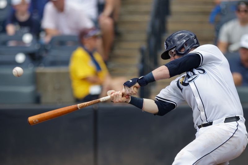 Jul 20, 2025; Tampa, Florida, USA; Tampa Bay Rays catcher Danny Jansen (19) hits a home runagainst the Baltimore Orioles in the fourth inning at George M. Steinbrenner Field. Mandatory Credit: Nathan Ray Seebeck-Imagn Images