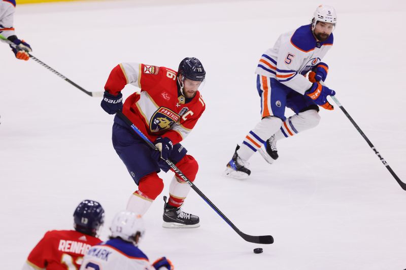 Jun 24, 2024; Sunrise, Florida, USA; Florida Panthers forward Aleksander Barkov (16) controls the puck  against Edmonton Oilers defenseman Cody Ceci (5) during the second period in game seven of the 2024 Stanley Cup Final at Amerant Bank Arena. Mandatory Credit: Sam Navarro-USA TODAY Sports